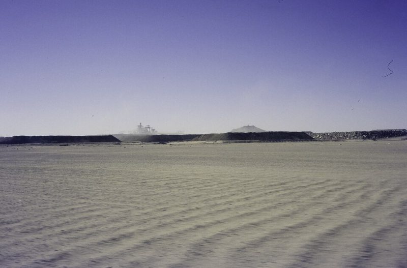 The desert near Arlit, Niger, with a uranium mine and its waste heap on the horizon, in 1985
