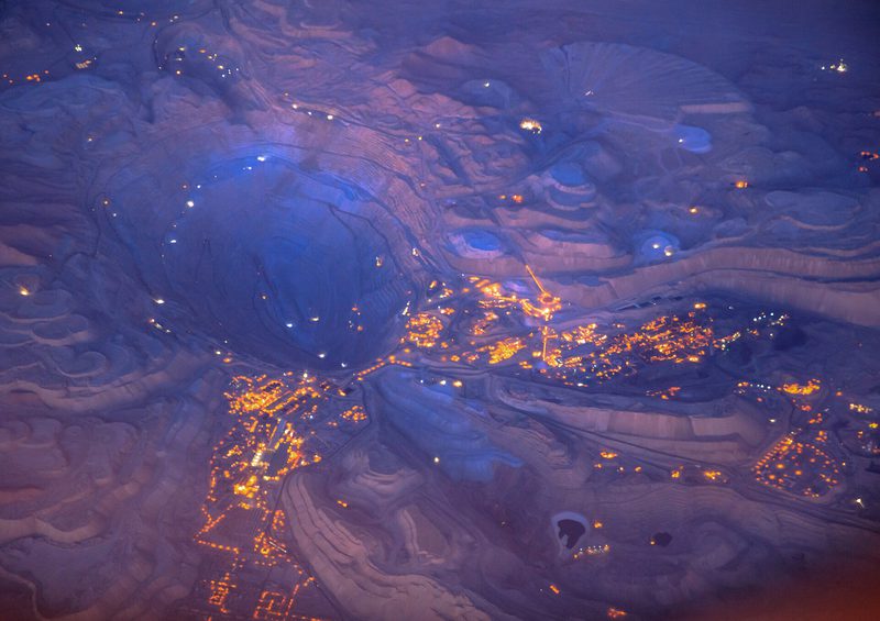 The Collahuasi copper mine in the Chilean Andes, lit up and seen from a plane