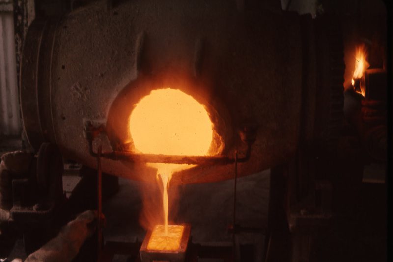 Molten gold poured from a furnace into an ingot mould