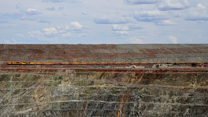 The Gwalia gold pit at Leonora, Western Australia, as a freight train passes
