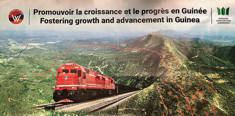 A Winning Consortium billboard for the Simandou railway in Guinea, 2024
